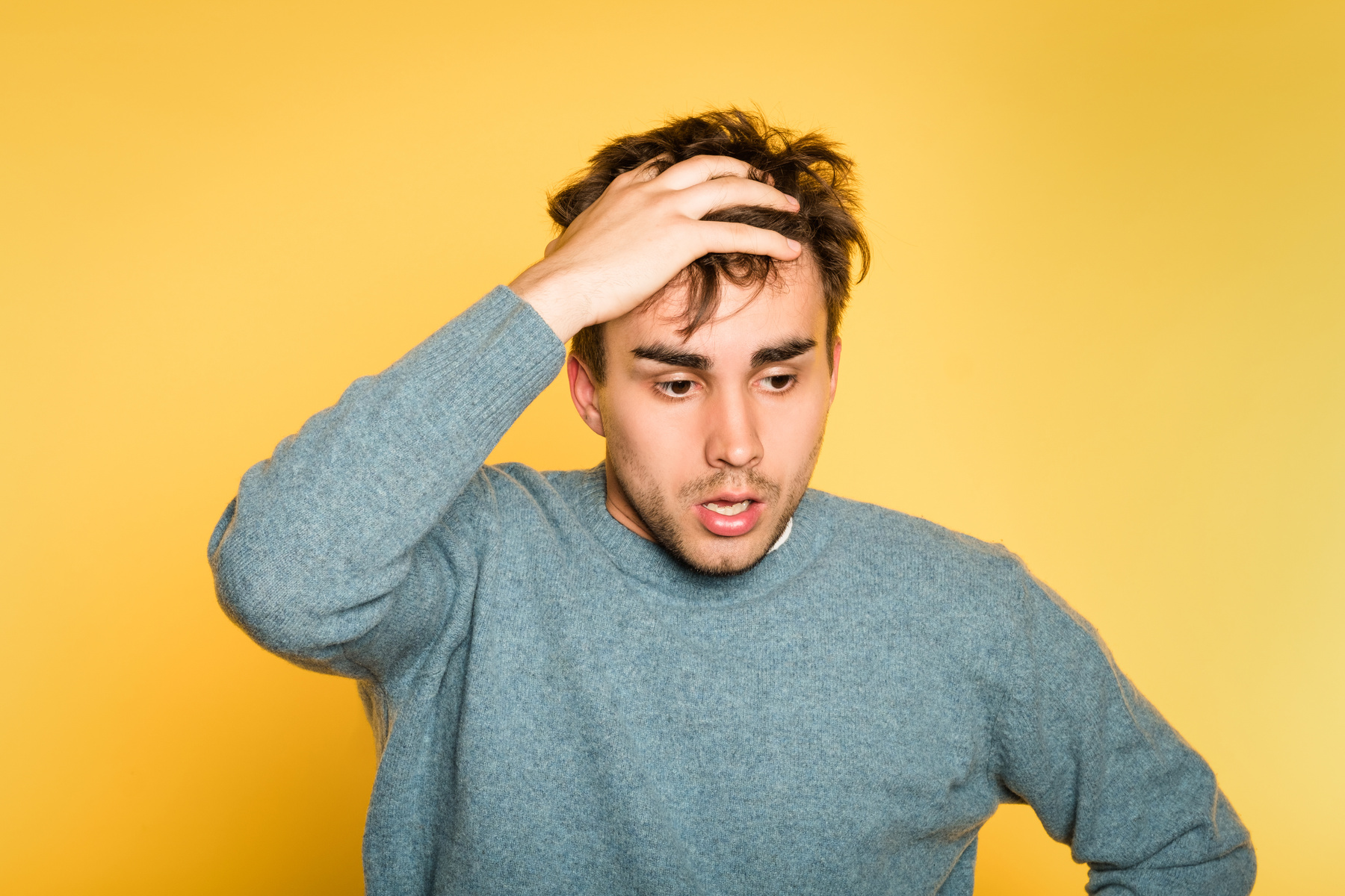 Worried Man With Hand on His Head in Despair