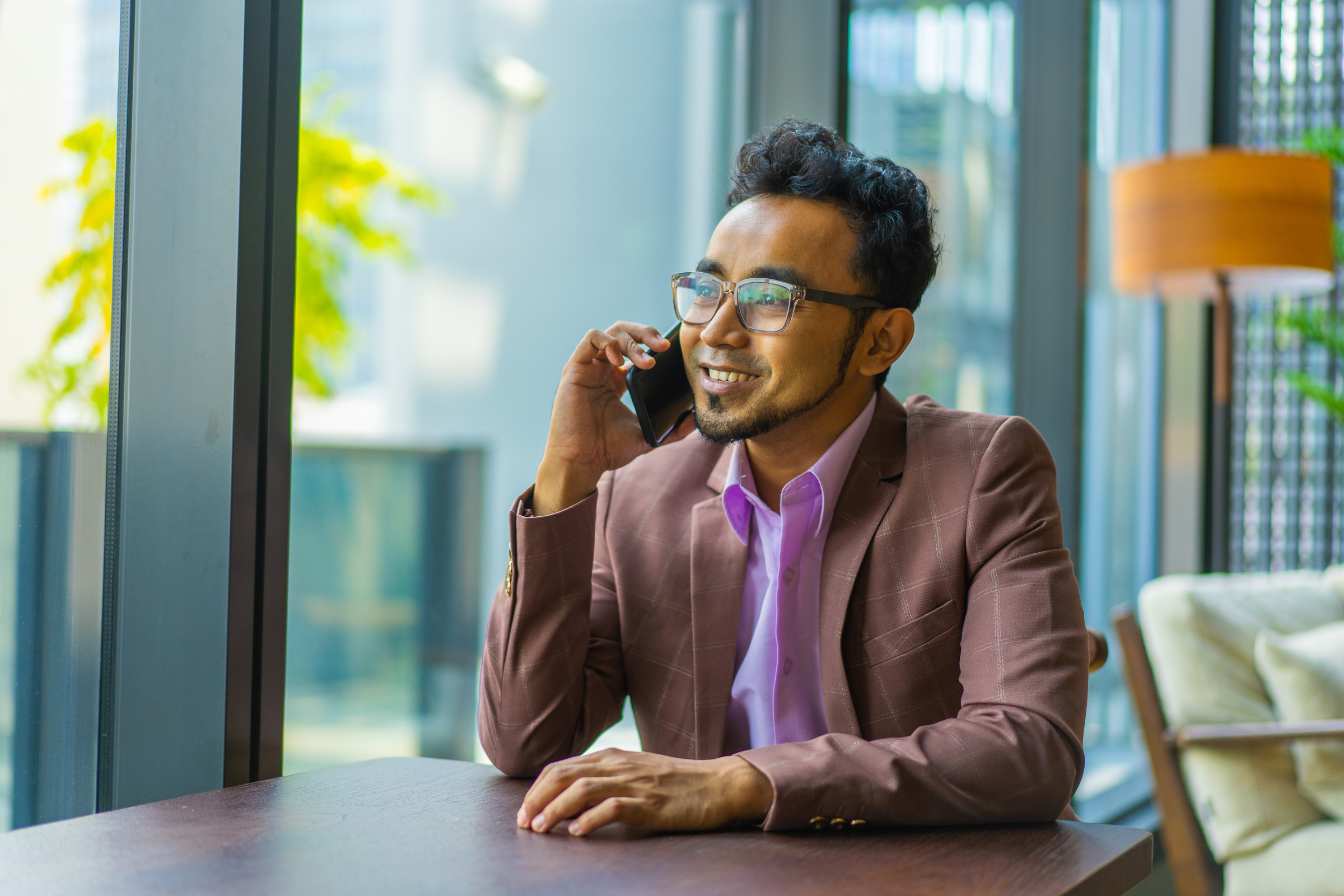 Asian Malay businessman talking on his mobile phone